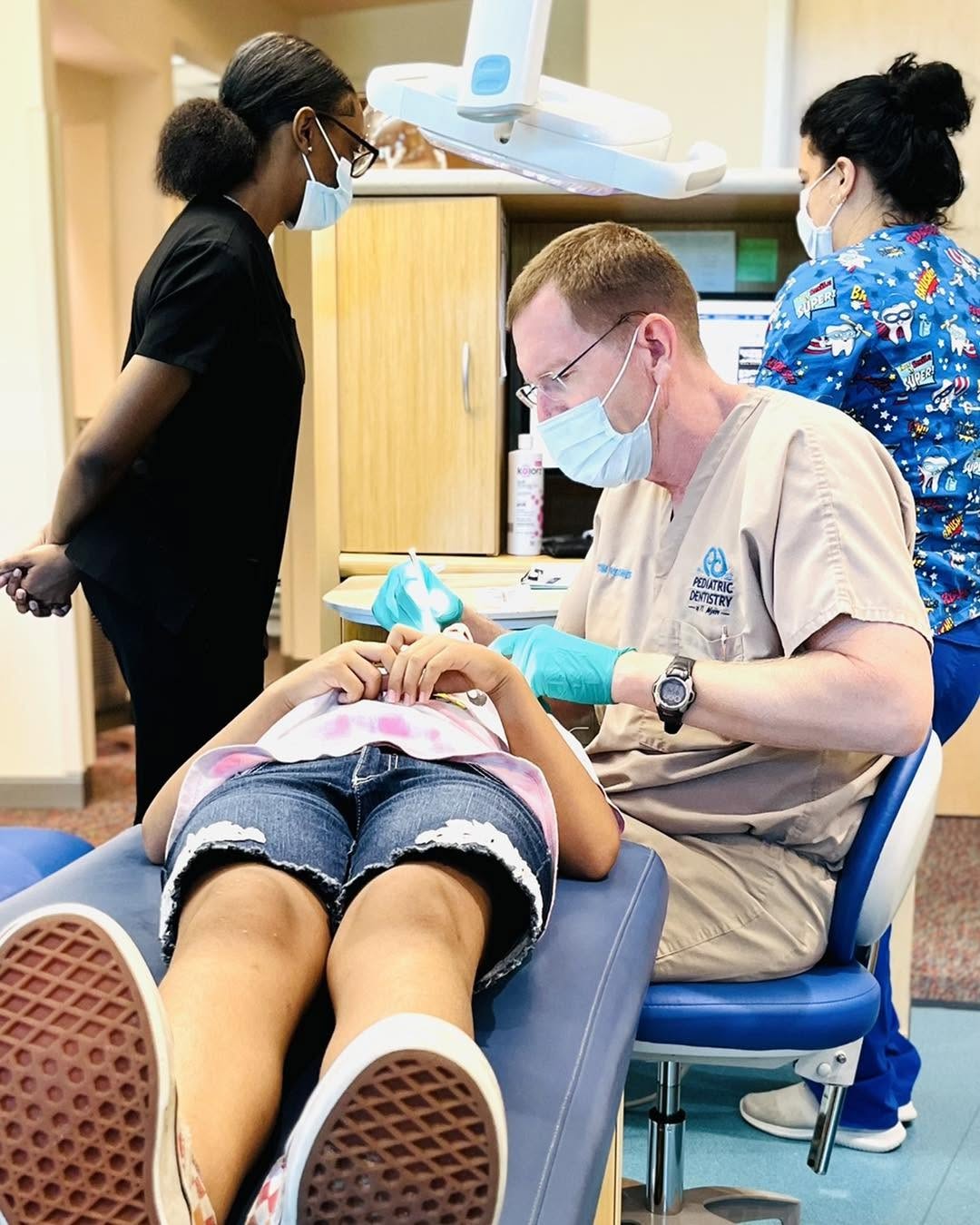 Child receiving a professional dental cleaning in Naples