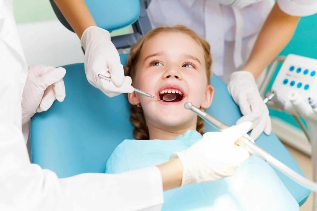 Kid in dentist's chair